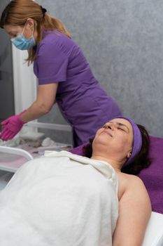While the beautician prepares for the next treatment, the client relaxes while lying on the beauty bed