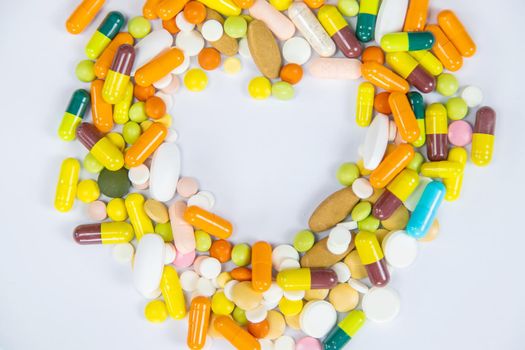 medical supplies on a yellow background, pills water treatment mask virus.