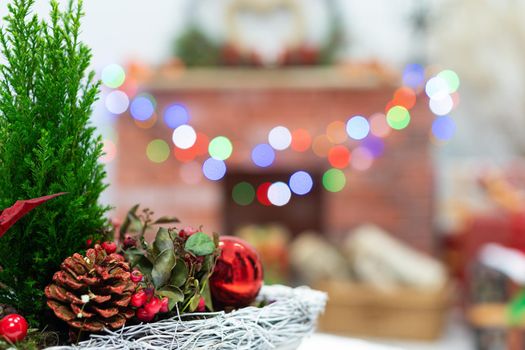 Close-up view of the Christmas reed that accompanies every Christmas. In the distance you can see the fireplace and the Christmas tree lights and the heart shape