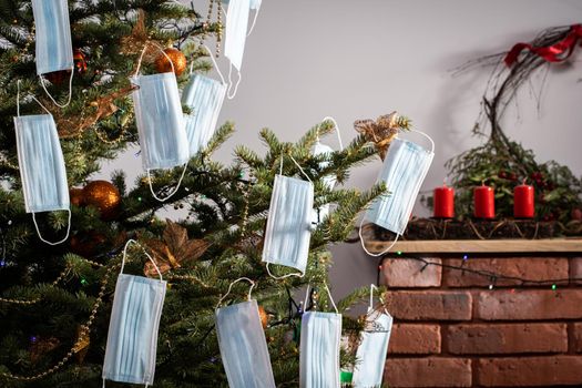 A Christmas tree in the foreground and a decorated fireplace in the second. Unusual Christmas.