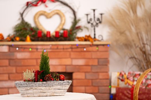 On the first one, ladies Christmas tablecloth and on the second one decorated fireplace for Christmas time