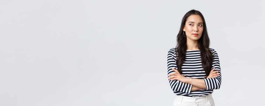 Lifestyle, people emotions and casual concept. Confident nice smiling asian woman cross arms chest confident, ready to help, listening to coworkers, taking part conversation.