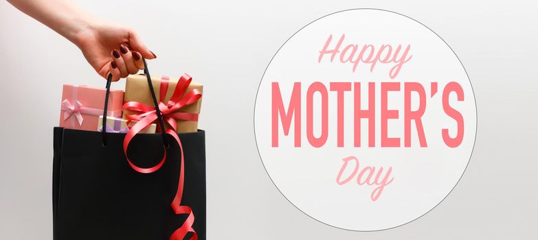 Top view aerial image of decoration Happy mothers day holiday background concept.Flat lay mom white card with gift box.