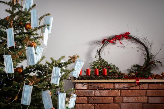 A Christmas tree in the foreground and a decorated fireplace in the second. Unusual Christmas.