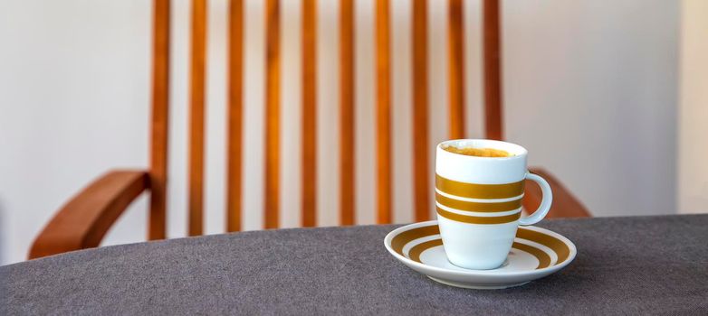 Banner with coffee cup on the table and chair. Concept