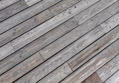 Natural grey surface from wood boards. Decking tiles. Horizontal view