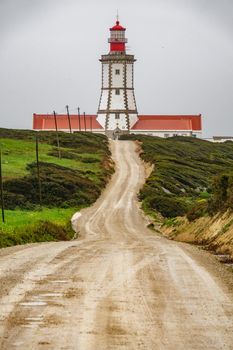 Cape Espichel lighthouse with track in Sesimbra, Portugal.