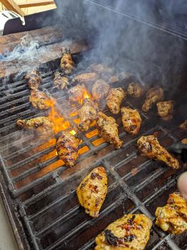 Chicken meat fried on a barbecue grill