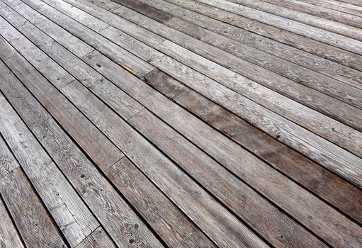 Natural grey surface from wood boards. Decking tiles. Horizontal view