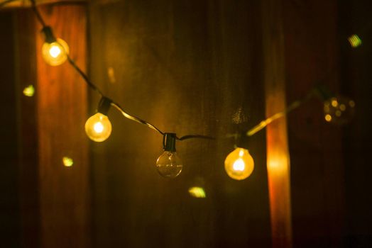 deck or porch decorated with lights