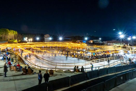 beautiful outdoor ice rink at night with lights