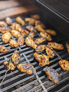 Chicken meat fried on a barbecue grill