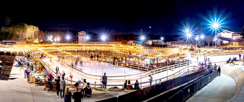 beautiful outdoor ice rink at night with lights