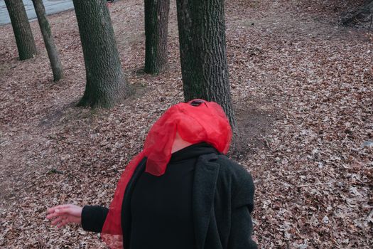 Superhero man with red mask and sunglasses fashion fighter in the park