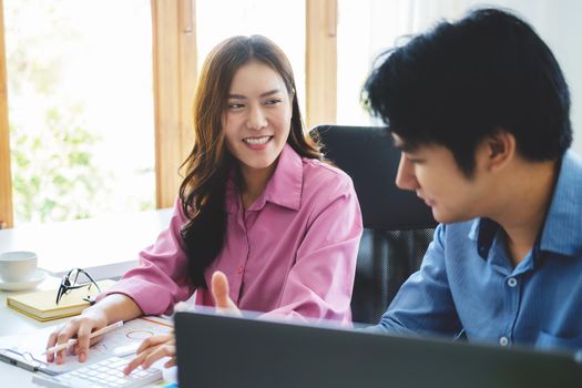 discussions, data analysis, risk management, female business owners smile with satisfaction after listening to the financial plan as an economist explains their marketing strategy