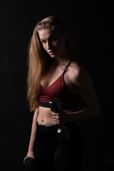 Her as beautiful shiny holds dumbbells knightly in a kira hands girl dumbbells fitness caucasian, from health lifestyle for person and trainer strength, sportswear people. Slim ABS