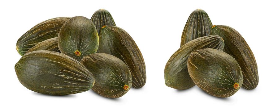Two piles of a tasty green tendral melons isolated on white background with copy space for text or images. Pumpkin plant family. Side view. Close-up shot.