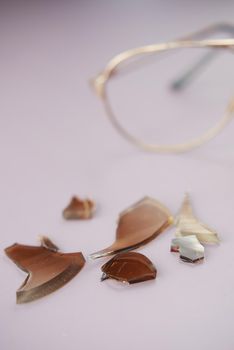 broken eye glass on table with copy space .
