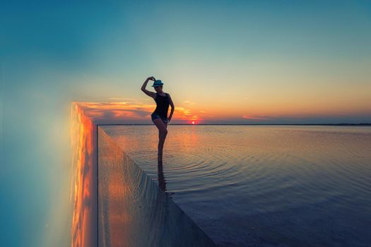 Beauty surreal sunset with woman on salty lake in Altay, Siberia, Russia
