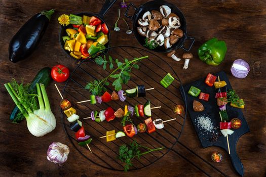 Vegetable skewer preparations on a worktop, top view