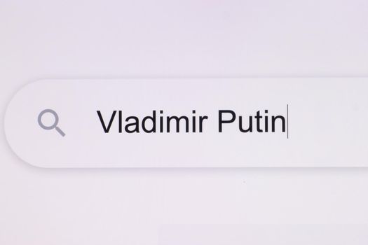Close Up of searching for Vladimir Putin on the Internet. Russian Federation attacked Ukraine. Typing text Vladimir Putin.