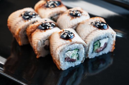 Sushi Rolls California with shrimp eel sesame. Food delivery. 4K Close-up