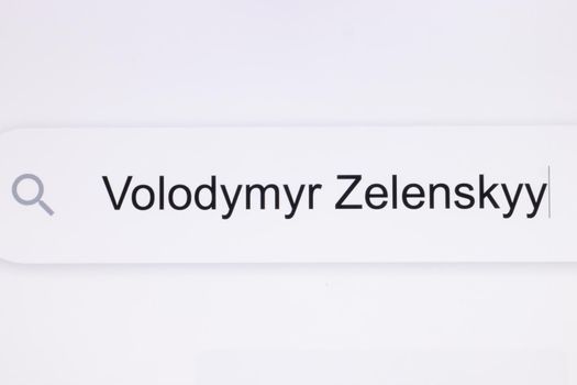 Volodymyr Zelensky headline titles across international media in white background. Close Up of searching for Volodymyr Zelensky on the Internet. President of Ukraine Volodymyr Zelensky