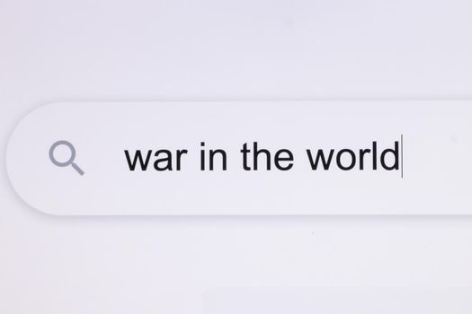 War in the world - Internet browser search bar typing hypotetical world conflict text . Typing the word War in the world in the browser on a pixelated screen.