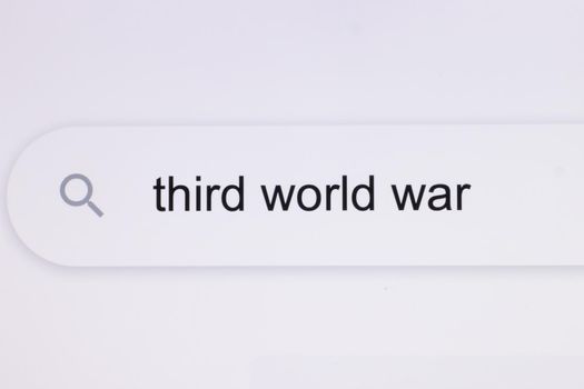 Third World War - Internet browser search bar typing hypotetical world conflict textt. Typing the word Third World War in the browser on a pixelated screen.