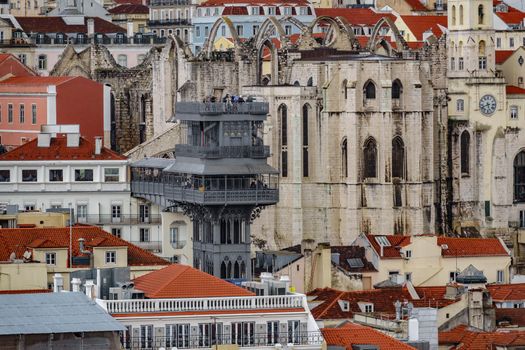 Long view of The Santa Justa Lift with houses in Lisbon