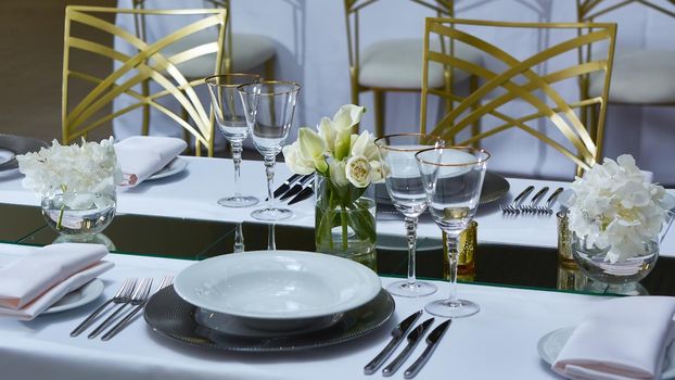 Beautifully organized event. Served festive table ready for guests. Shallow doff
