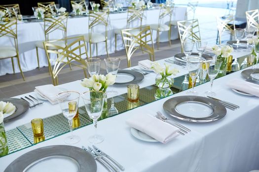 Beautifully organized event. Served festive table ready for guests. Shallow doff