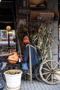 MOSCOW, RUSSIA - OCTOBER 3, 2021: Halloween holiday street decor in Moscow city, Russia. Halloween decoration on facade of restaurant "Black swan". Halloween autumn ornament with fall pumpkins. Shop