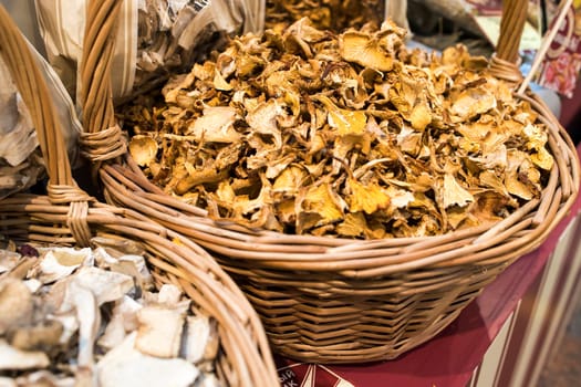 Dry mushrooms are sold in a wicker box