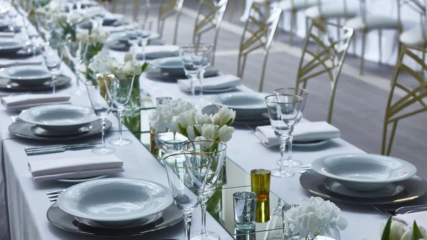 Beautifully organized event. Served festive table ready for guests. Shallow doff