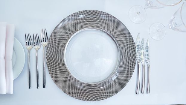 Beautifully organized event. Served festive table ready for guests. Shallow doff