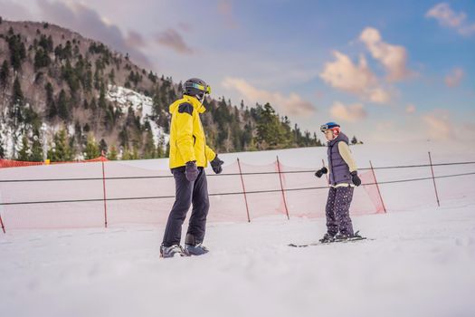 Woman learning to ski with instructor. Winter sport. Ski lesson in alpine school.