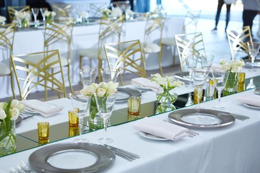 Beautifully organized event. Served festive table ready for guests. Shallow doff