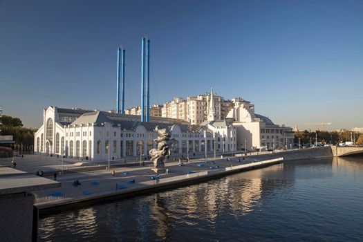 Moscow, Russia - September 4, 2021. Urs Fischer's sculpture Big Clay 4 on the Bolotnaya Embankment of Moscow river in front of the building of GES-2 , a cultural venue and former power plant