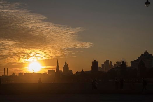 Moscow, Russia - 08 October 2021, View of the Kremlin from the Crimean bridge in the setting sun. Silhouettes at dusk