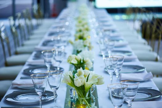 Elegance table set up with lotus flowers, selective focus