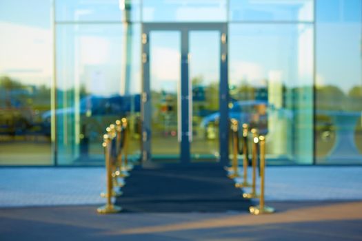 Black carpet between rope barriers. Blur background.
