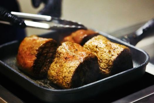 The beef steak in a frying pan. Shallow dof.