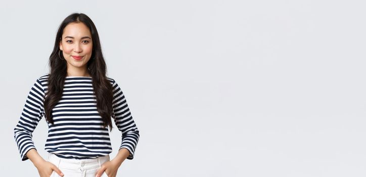 Lifestyle, beauty and fashion, people emotions concept. Confident friendly-looking smiling young woman ready climb to top, fighting for new job position, standing determined.