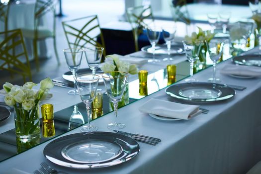 Elegance table set up with lotus flowers, selective focus