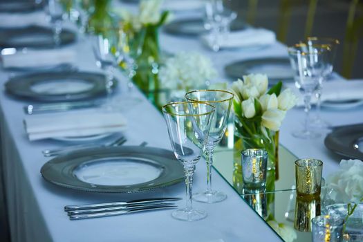 Elegance table set up with lotus flowers, selective focus