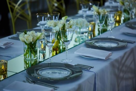 Elegance table set up with lotus flowers, selective focus