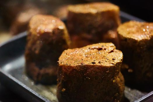 The beef steak in a frying pan. Shallow dof.