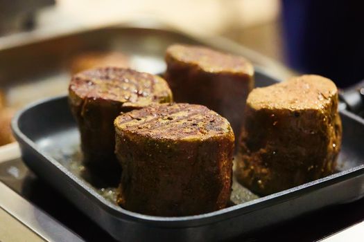 The beef steak in a frying pan. Shallow dof.