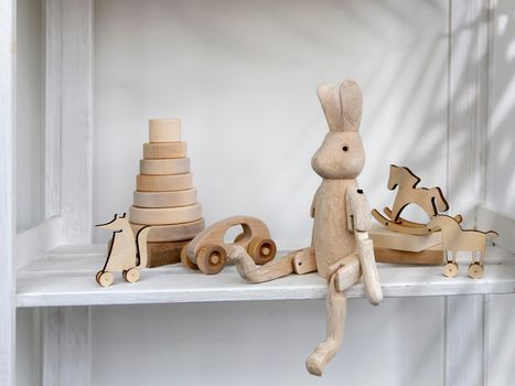 Wooden toys made of natural wood, eco-friendly are in the children's room for learning and playing. Space for text. Copy space